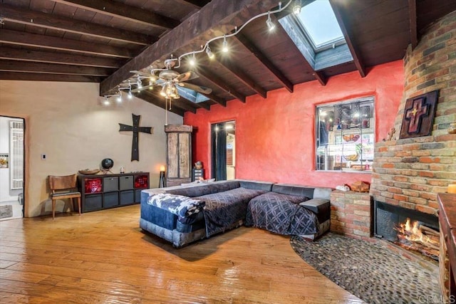4210 Black Mountain Rd, La Mesa, CA 91941 - living area with hardwood / wood-style flooring, wooden ceiling, ceiling fan, a skylight, and a fireplace