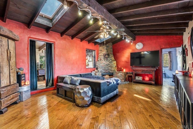 4210 Black Mountain Rd, La Mesa, CA 91941 - living room featuring wood-type flooring, wooden ceiling, a ceiling fan, a skylight, and track lighting