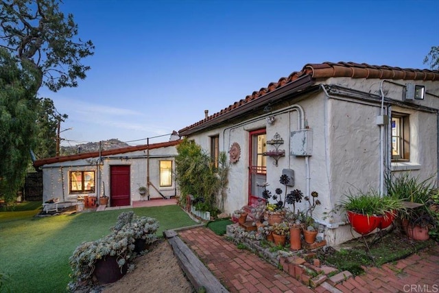 4210 Black Mountain Rd, La Mesa, CA 91941 - view of front of house with a front yard, stucco siding, and a tiled roof