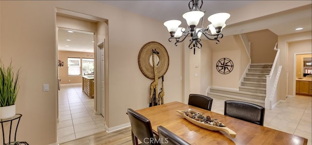 dining room featuring baseboards, a chandelier, recessed lighting, stairs, and light tile patterned flooring