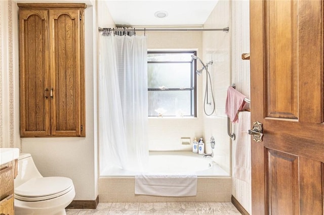 7040 Kenyon Ave, Hesperia, CA 92345 - bathroom with tiled shower / bath combo, toilet, and tile patterned floors