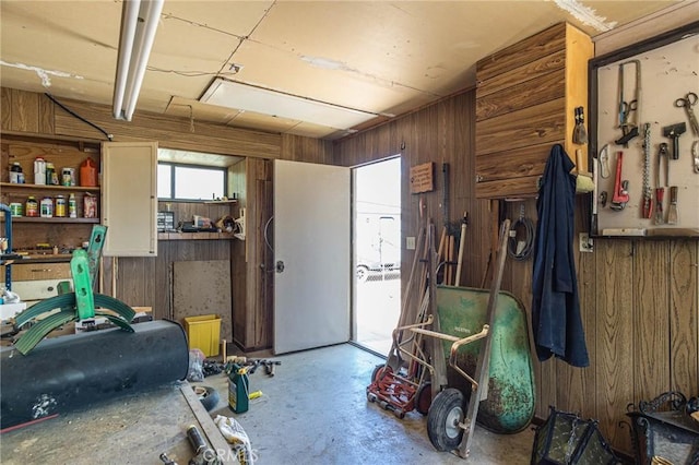 7040 Kenyon Ave, Hesperia, CA 92345 - garage with wood walls and a workshop area