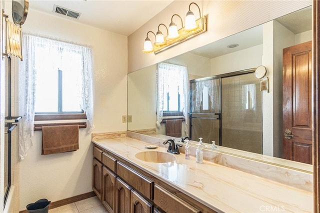 7040 Kenyon Ave, Hesperia, CA 92345 - bathroom featuring a shower with shower door, tile patterned floors, vanity, and visible vents