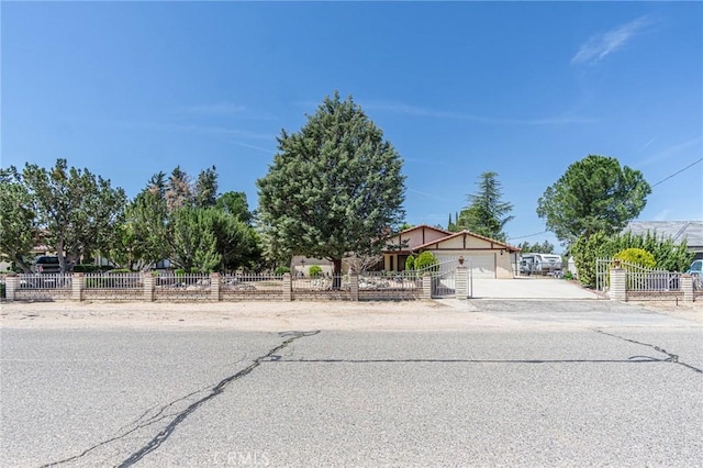 7040 Kenyon Ave, Hesperia, CA 92345 - view of front of home with an attached garage, a fenced front yard, and concrete driveway
