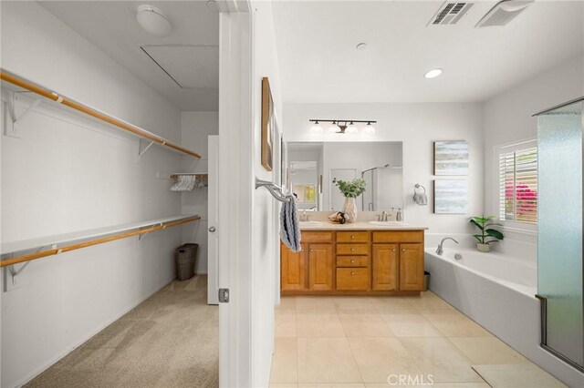 73992 Van Gogh Dr, Palm Desert, CA 92211 - full bath with double vanity, a garden tub, tile patterned floors, and a walk in closet