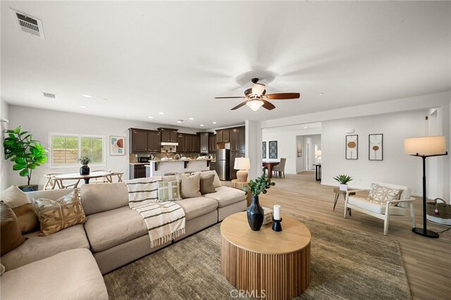 73992 Van Gogh Dr, Palm Desert, CA 92211 - living room featuring wood finished floors, ceiling fan, and recessed lighting