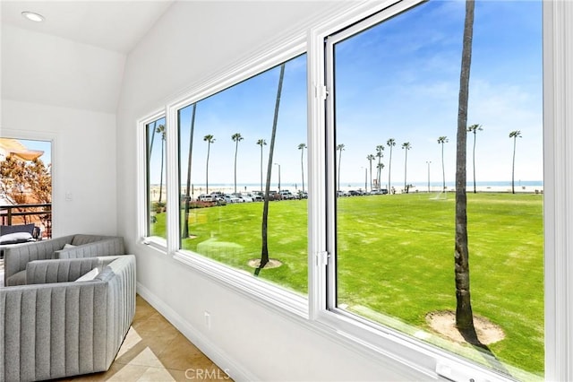 sunroom / solarium with a water view