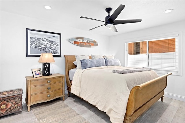 bedroom with light wood-type flooring, baseboards, a ceiling fan, and recessed lighting