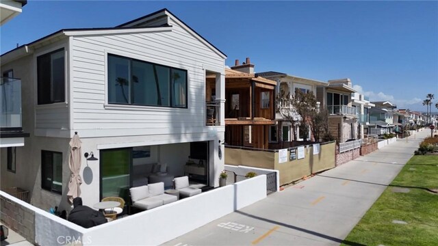 916 E Oceanfront, Newport Beach, CA 92661 - rear view of house featuring a residential view
