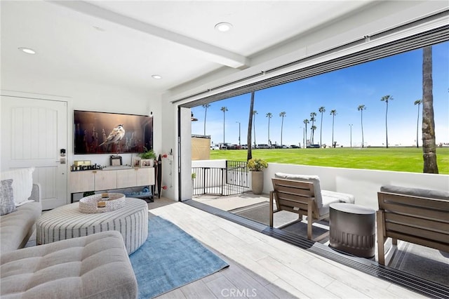 916 E Oceanfront, Newport Beach, CA 92661 - living area with wood finished floors, beam ceiling, and recessed lighting
