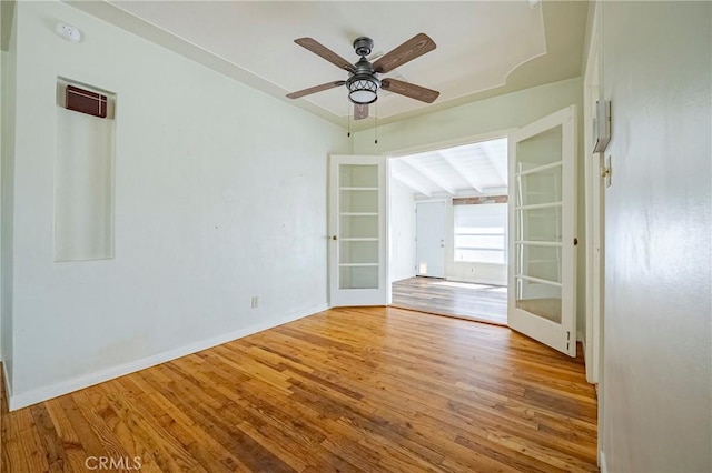 2550 5th Ave, Merced, CA 95340 - spare room featuring french doors, a smoke detector, wood finished floors, ceiling fan, and vaulted ceiling