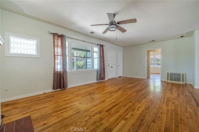 2550 5th Ave, Merced, CA 95340 - unfurnished living room with healthy amount of natural light, wood finished floors, and a ceiling fan