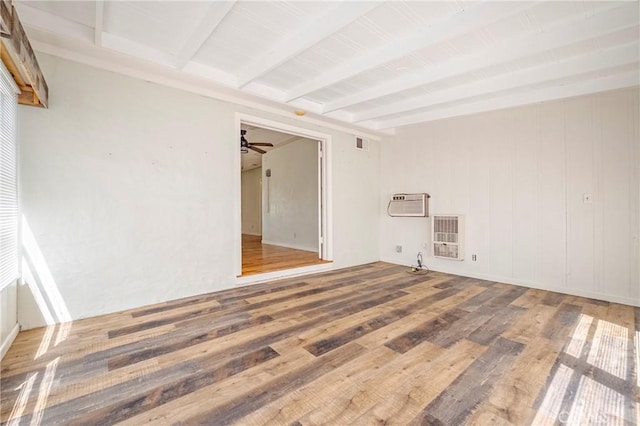2550 5th Ave, Merced, CA 95340 - empty room featuring beam ceiling, heating unit, wood finished floors, ceiling fan, and a wall unit AC