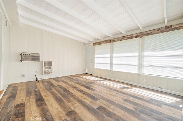 2550 5th Ave, Merced, CA 95340 - unfurnished room featuring beam ceiling, wood finished floors, heating unit, and a wall mounted AC