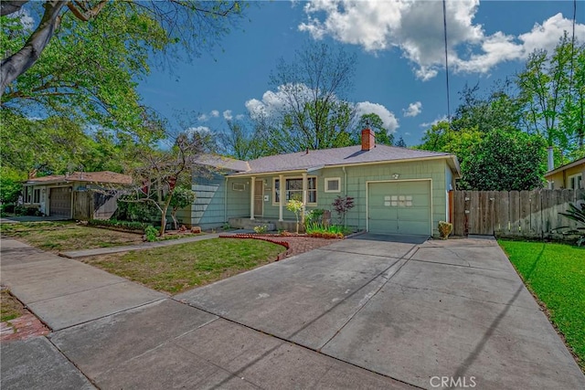 2550 5th Ave, Merced, CA 95340 - single story home with a garage, a chimney, and driveway
