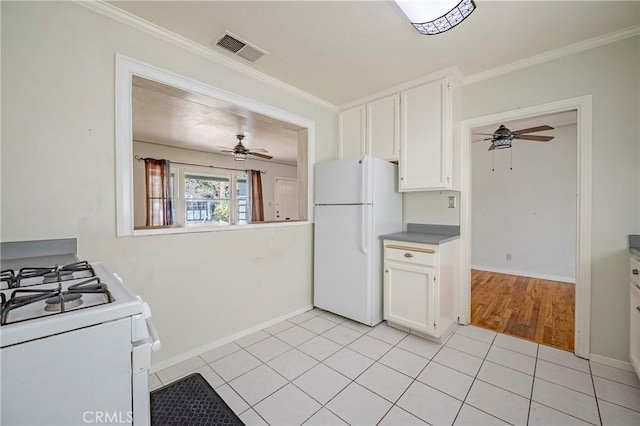 2550 5th Ave, Merced, CA 95340 - kitchen featuring white appliances, ceiling fan, white cabinets, and ornamental molding