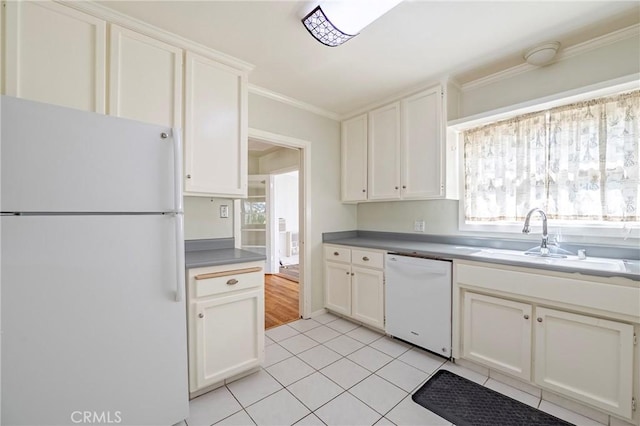 2550 5th Ave, Merced, CA 95340 - kitchen featuring white appliances, ornamental molding, light tile patterned floors, and white cabinets