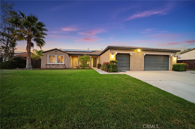 20536 Black Walnut Ct, Wildomar, CA 92595 - view of front facade featuring stucco siding, driveway, a garage, solar panels, and a tiled roof