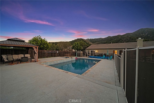 20536 Black Walnut Ct, Wildomar, CA 92595 - view of swimming pool with a gazebo, a patio area, a mountain view, and a fenced backyard