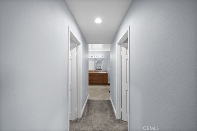 20536 Black Walnut Ct, Wildomar, CA 92595 - corridor with light carpet and baseboards