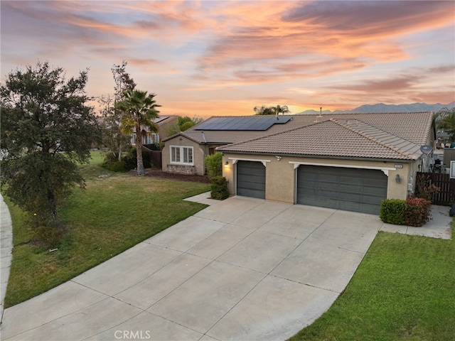 20536 Black Walnut Ct, Wildomar, CA 92595 - view of front of house with stucco siding, a tiled roof, a garage, a front lawn, and driveway