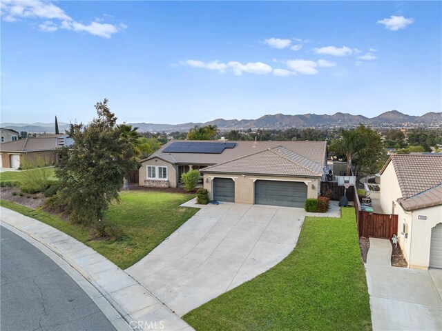 20536 Black Walnut Ct, Wildomar, CA 92595 - ranch-style home featuring an attached garage, a mountain view, and driveway
