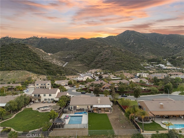 aerial view at dusk with a residential view and a mountain view