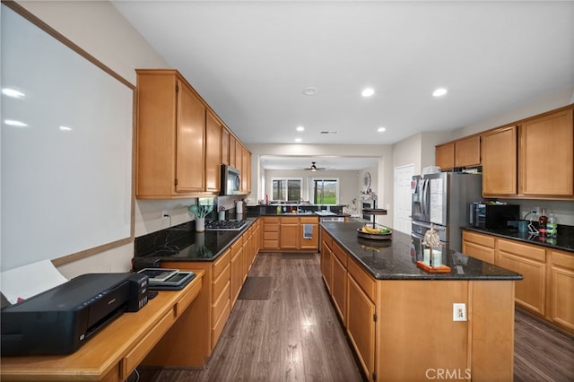 20536 Black Walnut Ct, Wildomar, CA 92595 - kitchen with stainless steel appliances, a center island, a peninsula, a sink, and dark wood finished floors