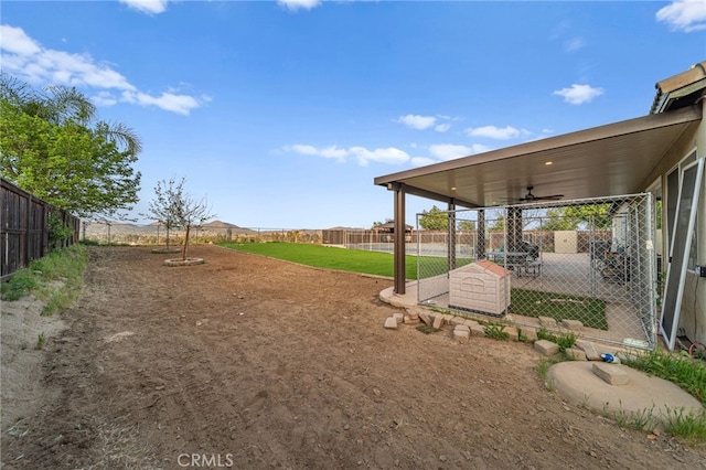20536 Black Walnut Ct, Wildomar, CA 92595 - fenced backyard featuring a ceiling fan