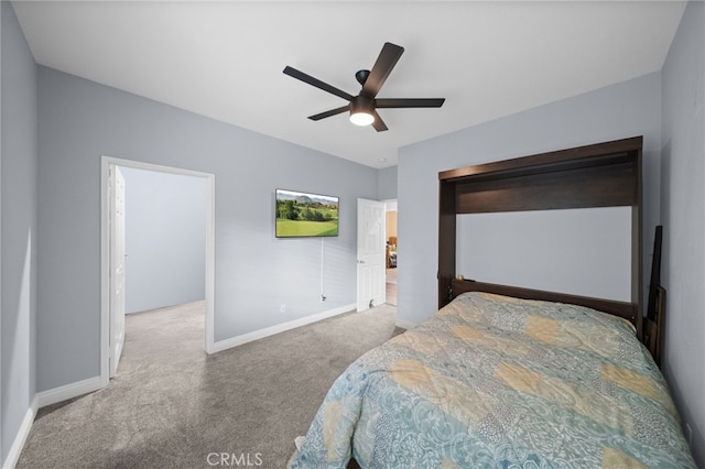 carpeted bedroom with baseboards and ceiling fan