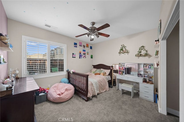 carpeted bedroom with ceiling fan and visible vents