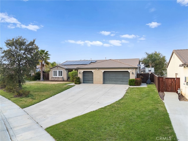 ranch-style home with a garage, stucco siding, a front yard, concrete driveway, and solar panels