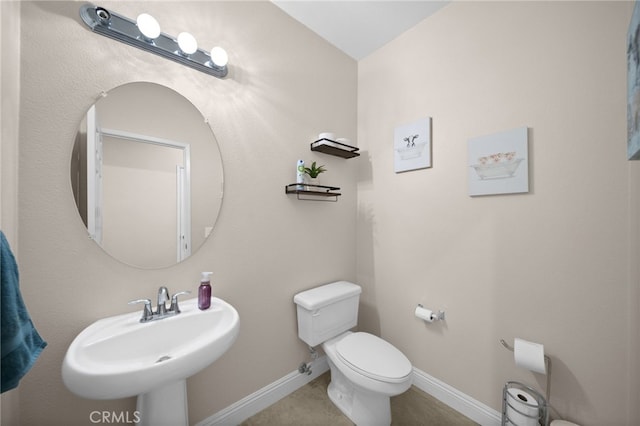 20536 Black Walnut Ct, Wildomar, CA 92595 - half bathroom featuring toilet, a sink, and baseboards