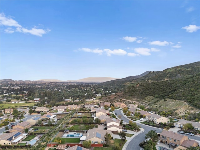 drone / aerial view with a residential view and a mountain view
