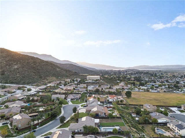 birds eye view of property with a mountain view and a residential view