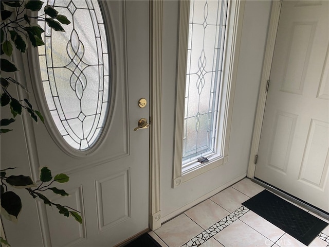 foyer entrance featuring light tile patterned floors