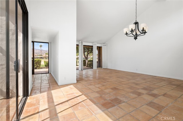 263 Serena Dr, Palm Desert, CA 92260 - empty room featuring high vaulted ceiling, a chandelier, and baseboards