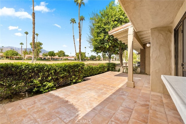 view of patio / terrace featuring a mountain view