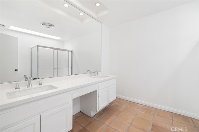 full bath featuring a stall shower, recessed lighting, double vanity, baseboards, and tile patterned flooring