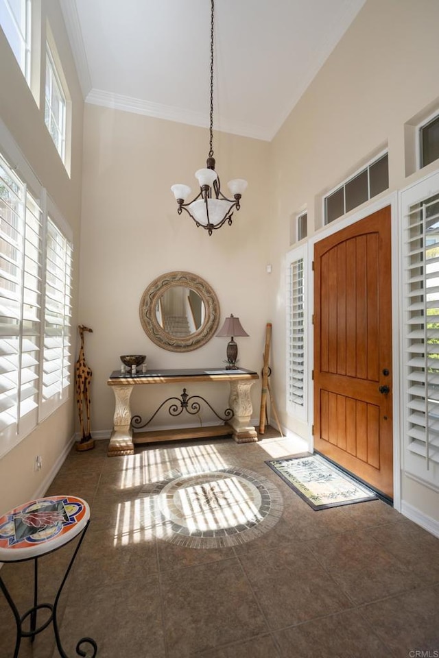 2927 Rancho Cortes, Carlsbad, CA 92009 - tiled foyer entrance with a chandelier, a towering ceiling, ornamental molding, and baseboards