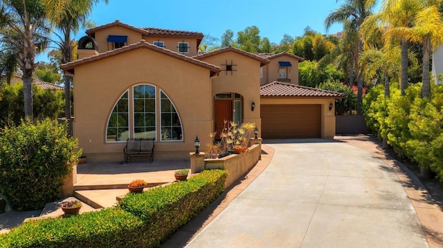 2927 Rancho Cortes, Carlsbad, CA 92009 - mediterranean / spanish home with stucco siding, a tiled roof, a garage, and driveway