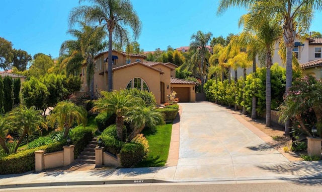 2927 Rancho Cortes, Carlsbad, CA 92009 - mediterranean / spanish house featuring a tile roof, concrete driveway, a garage, and stucco siding