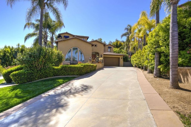 2927 Rancho Cortes, Carlsbad, CA 92009 - mediterranean / spanish house with stucco siding, driveway, a garage, and a tiled roof