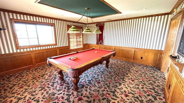 playroom featuring crown molding, wainscoting, and wallpapered walls