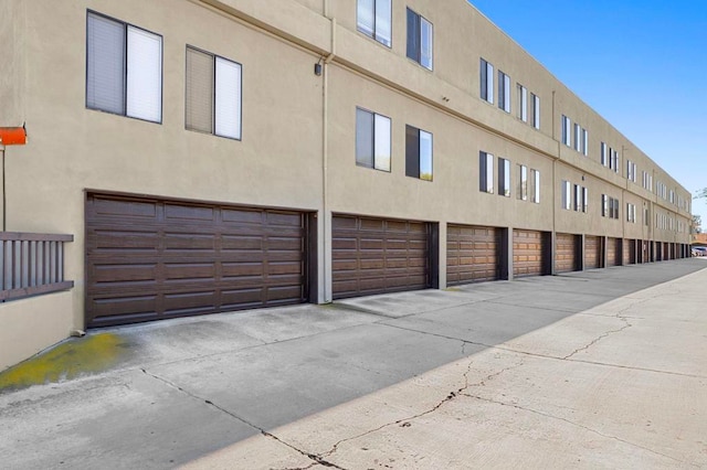 5170 Clairemont Mesa Blvd Unit 27, San Diego, CA 92117 - view of property featuring a garage