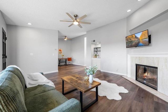 5170 Clairemont Mesa Blvd Unit 27, San Diego, CA 92117 - living room featuring a ceiling fan, wood finished floors, a high end fireplace, recessed lighting, and a textured ceiling