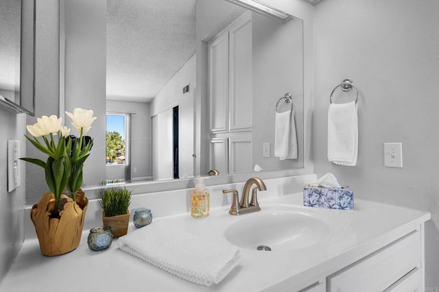 5170 Clairemont Mesa Blvd Unit 27, San Diego, CA 92117 - bathroom with vanity and a textured ceiling