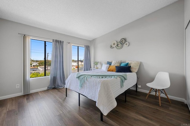 5170 Clairemont Mesa Blvd Unit 27, San Diego, CA 92117 - bedroom with wood finished floors and a textured ceiling