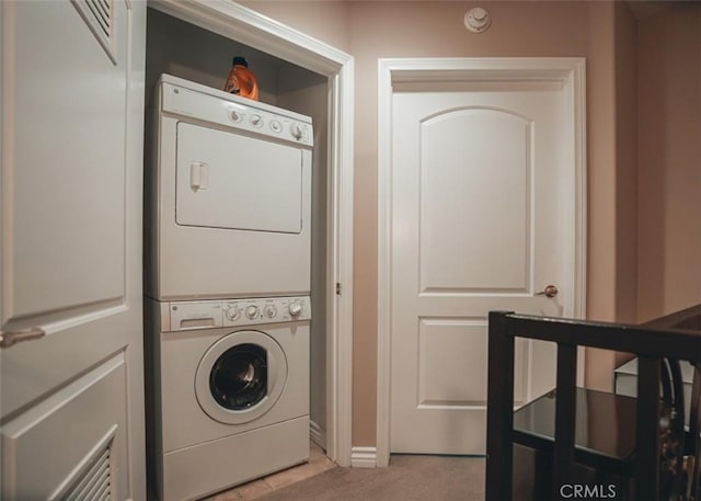 1153 San Rafael Ave Unit 105, Glendale, CA 91202 - laundry area with laundry area, stacked washer and dryer, baseboards, and carpet