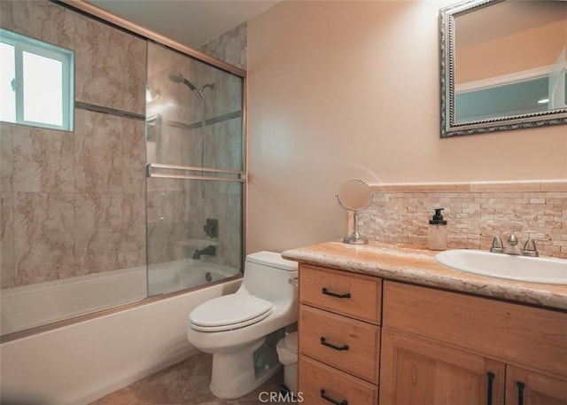 1153 San Rafael Ave Unit 105, Glendale, CA 91202 - full bathroom with tasteful backsplash, toilet, vanity, and bath / shower combo with glass door